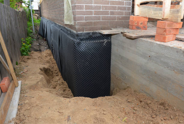 Happy homeowners after waterproofing job in Dry Ridge